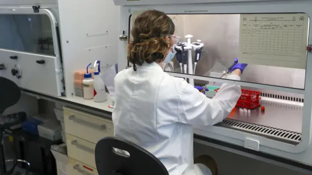 A scientist at work in the manufacturing laboratory where a vaccine against Covid-19 has been produced at the Oxford Vaccine Group's facility at the Churchill Hospital in Oxford.