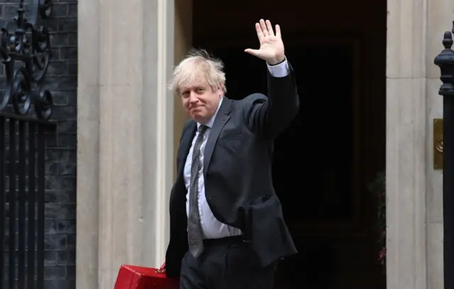 Boris Johnson leaving No 10 earlier as he headed to the Commons to address MPs ahead of their vote to approve the Brexit trade agreement with the EU.