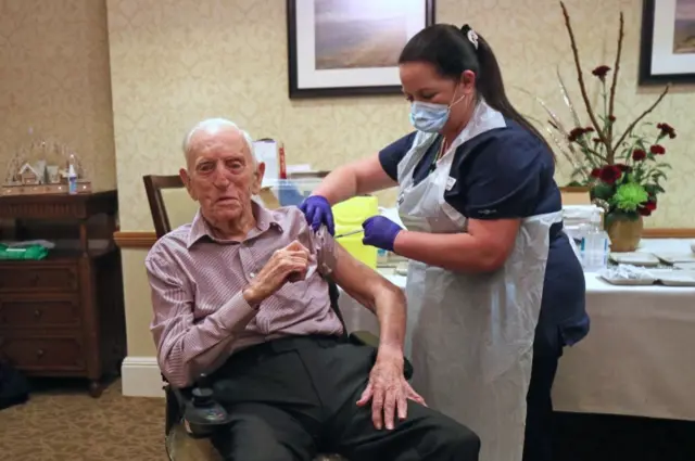 A man receiving the Pfizer vaccine