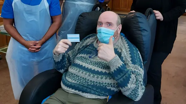 John Heggarty, 61, was among the first to get the jab at the care home