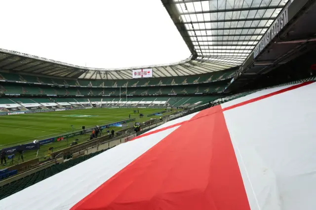 Twickenham stadium with a big England flag in the stands