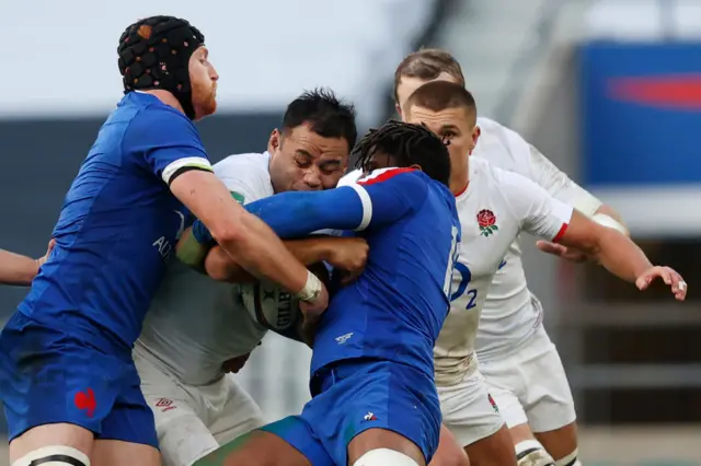 Billy Vunipola runs into French defenders