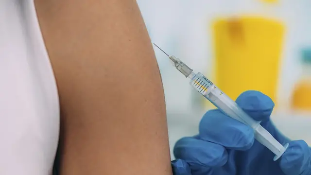 An arm being injected