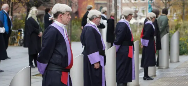 Court staff line funeral route