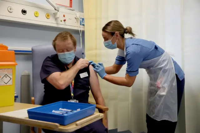 Andrew Mencnarowski, a clinical lead at NHS Lothian, was among the first to receive the jab in Scotland