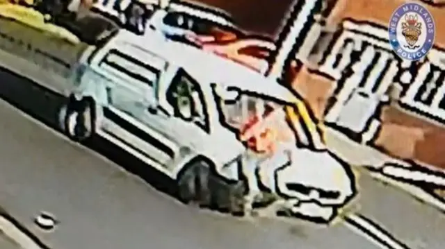 CCTV of man clinging to bonnet