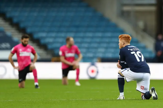 Millwall and Derby players knee before their weekend game