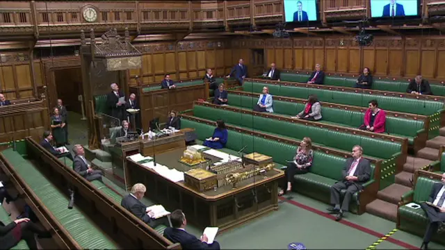 Keir Starmer on the video screens in the Commons chamber