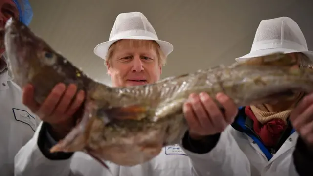 Boris Johnson with a fish