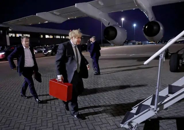 Boris Johnson and UK chief Brexit negotiator Lord Frost boarding their flight to Brussels earlier