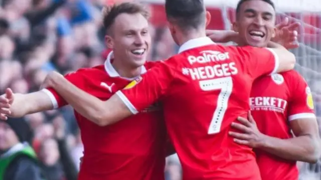 Cauley Woodrow (left) scores against Wycombe in 2019