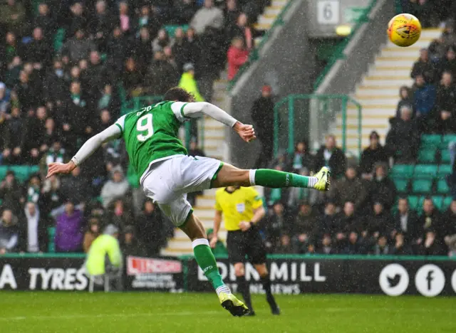 Christian Doidge heads Hibs level late in the first half