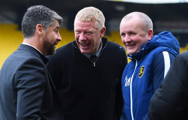 Stephen Robinson and Gary Holt exchange a  joke before kick off