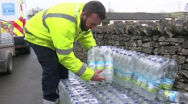 Man collecting bottled water