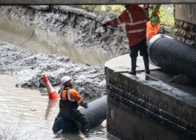 Flood defences are prepared in Mytholmroyd, in the Upper Calder Valley in West Yorkshire