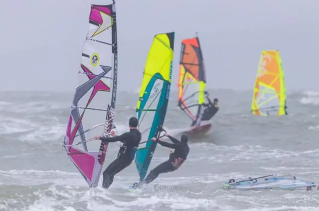 Windsurfers in water