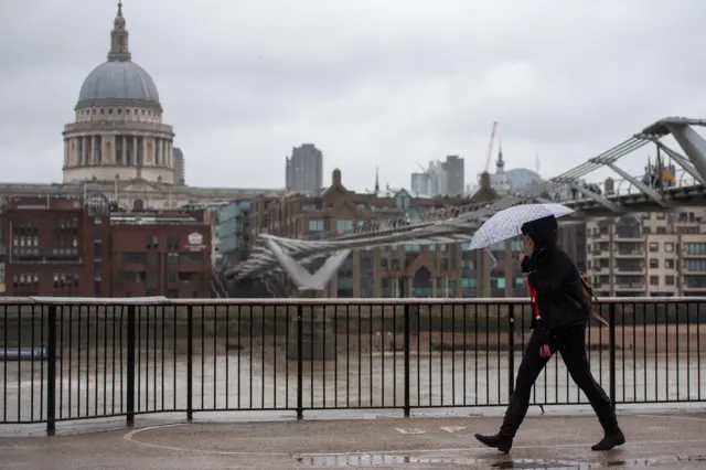 Woman walks along South Bank