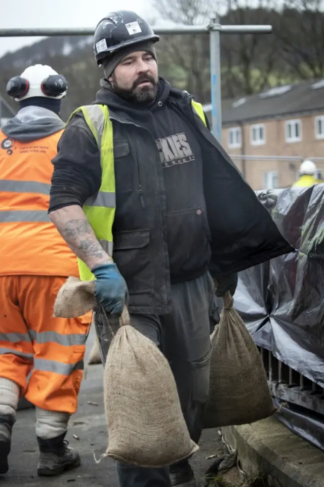 Workers construct flood defences in Mytholmroyd