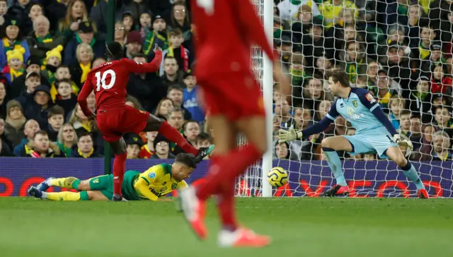 Liverpool's Sadio Mane scores their first goal against Norwich