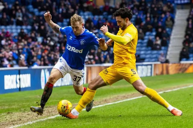 : Scott Arfield and Ricki Lamie contest for possession at Ibrox