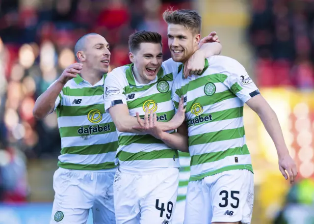 Celtic celebrate Kristoffer Ajer's late winner at Pittodrie