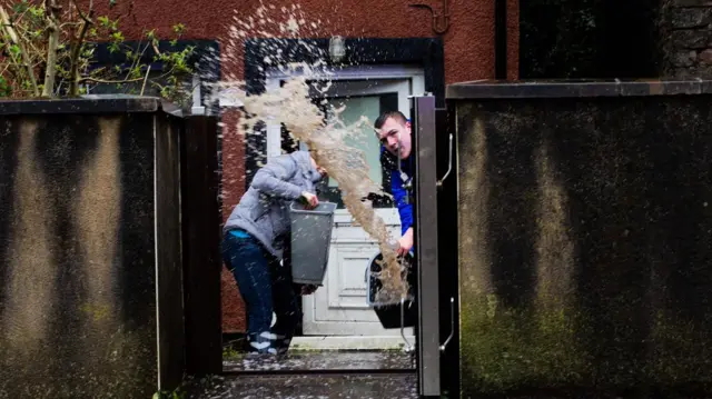 People chuck water out of their house in Pontypridd