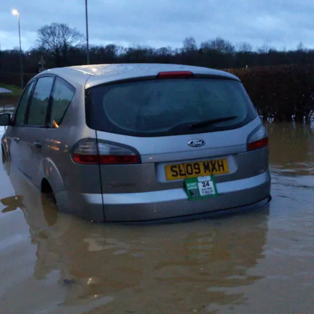 Taxi stuck in flood water