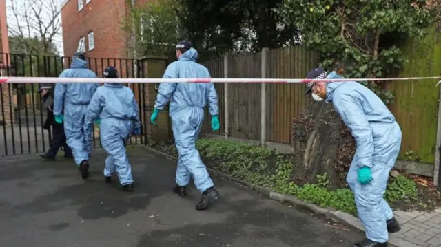 Police officers carrying out searches relating to terrorism