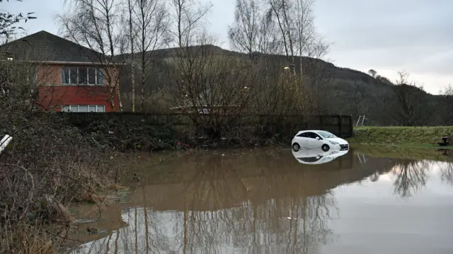 A car washed-away during flooding in Nantgarw, in south Wales