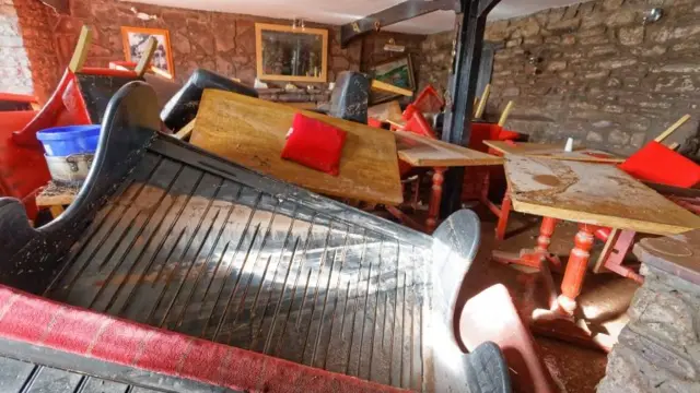 The damaged interior of the Bridge End Inn in Crickhowell, Wales