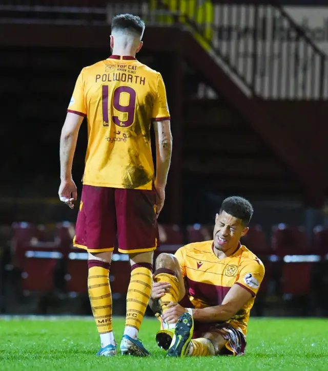 Motherwell defender Jake Carroll is down injured