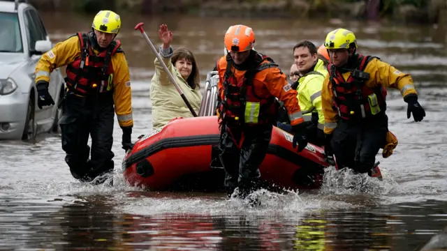 Care home resident being rescued by boat