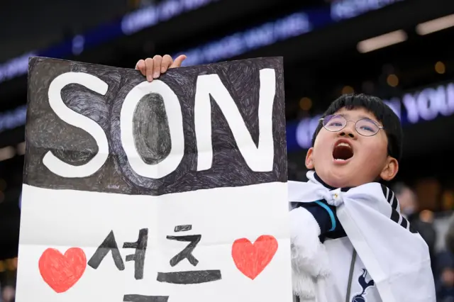 Son Heung-min fan holding up a Son poster