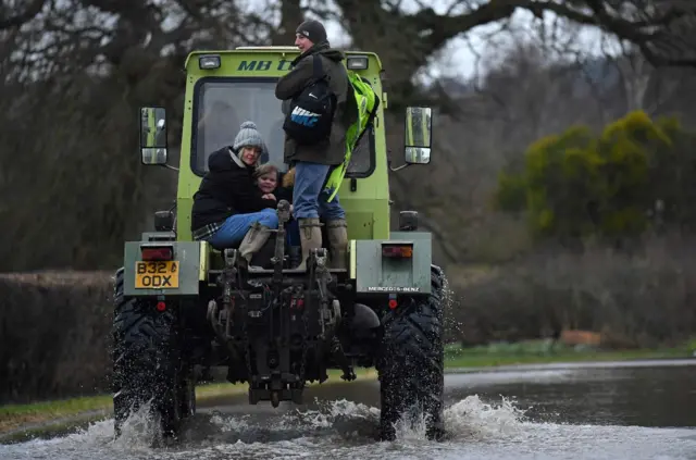 Tractor rescuing residents