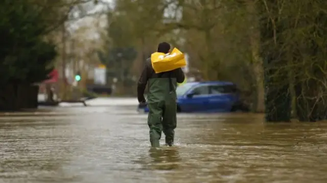 One man waded through floods in Upton upon Severn to do the shopping