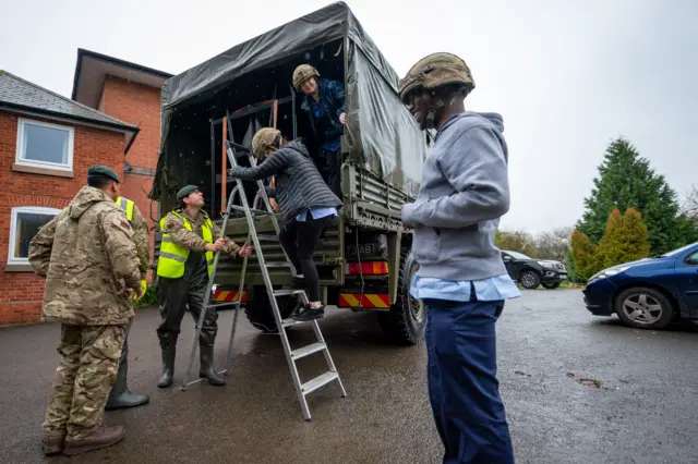 British Army ferrying workers