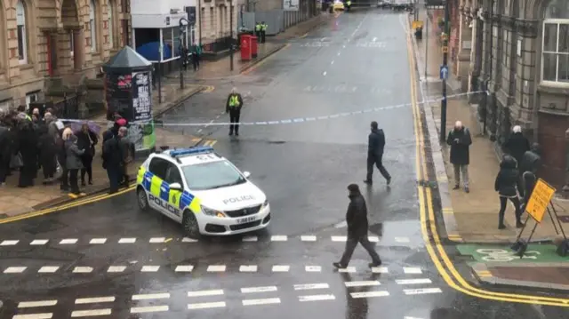 Police car at the scene blocking access