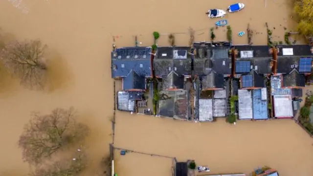 An aerial view shows flooded homes on the banks of the Severn near Worcester