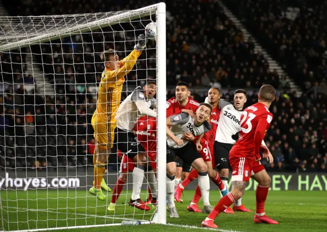 Marek Rodak clears a Derby corner