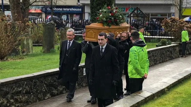 Harry Gregg's coffin arrives at St Patrick's Parish Church in Coleraine