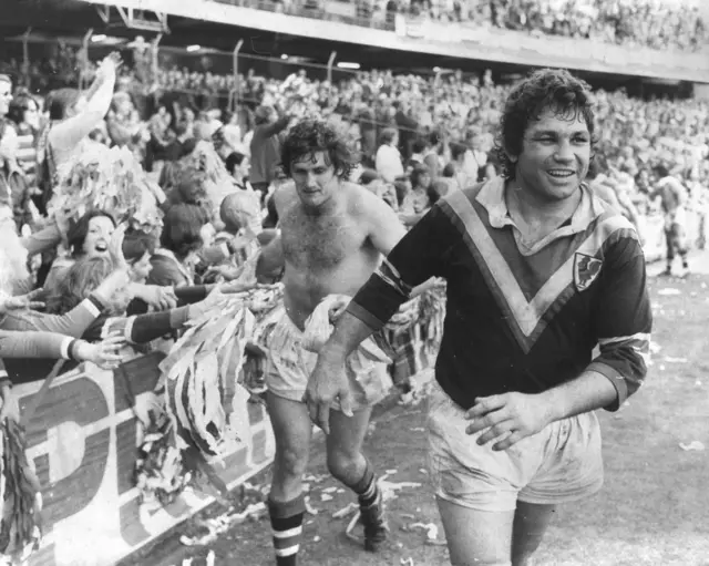 Artie Beetson and Bill Mullins celebrate after the 1975 Grand Final