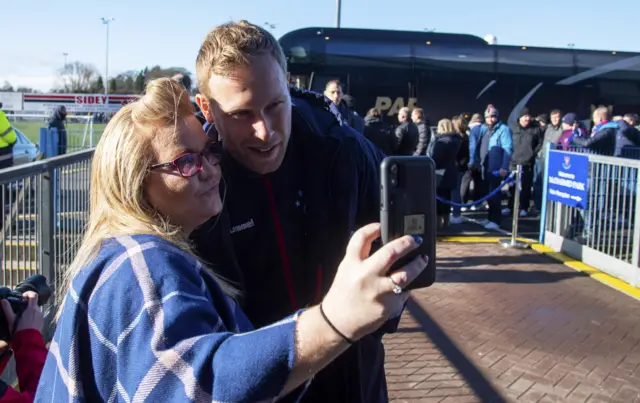 Rangers's Scott Arfield with a fan at McDiarmid Park