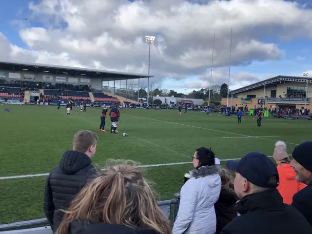 Fans watch England players warm up from the touchline