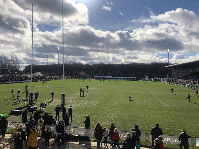 Teams warm up in the sunshine