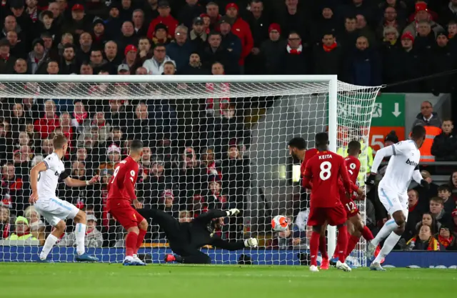 Issa Diop of West Ham United scores his sides first goal during the Premier League match between Liverpool FC and West Ham United at Anfield