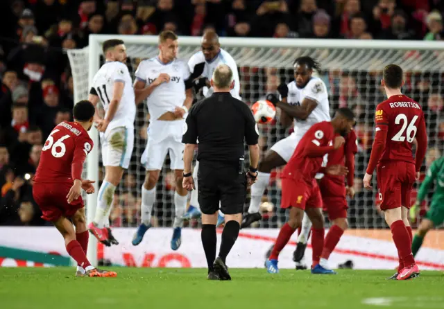 Trent Alexander-Arnold (L) of Liverpool takes a free kick West Ham during the English Premier League match between Liverpool and West Ham in Liverpool