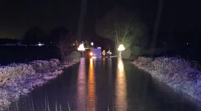 van stuck in water