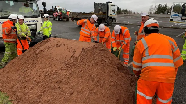 Sandbags being filled in Ironbridge