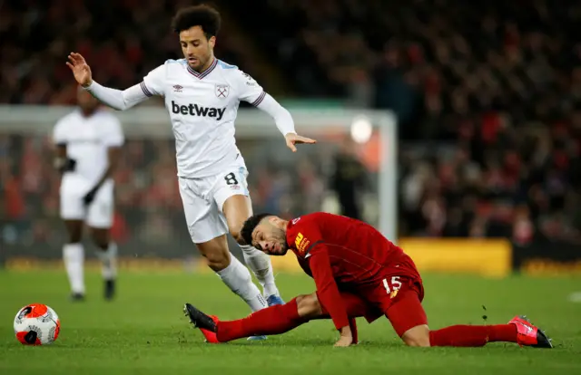 Liverpool's Alex Oxlade-Chamberlain in action with West Ham United's Felipe Anderson