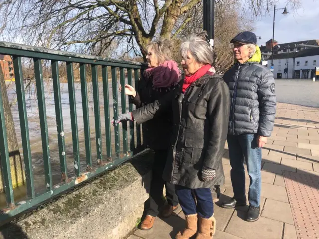 People watching river levels